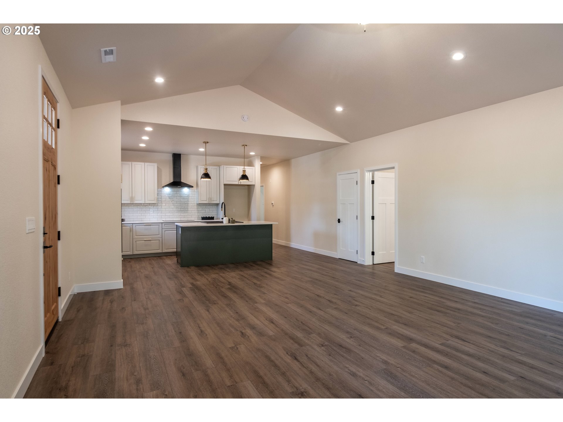 1 Bonnett Way Florence, OR 97439 - Photo 10 of 33 a view of kitchen and empty room with wooden floor