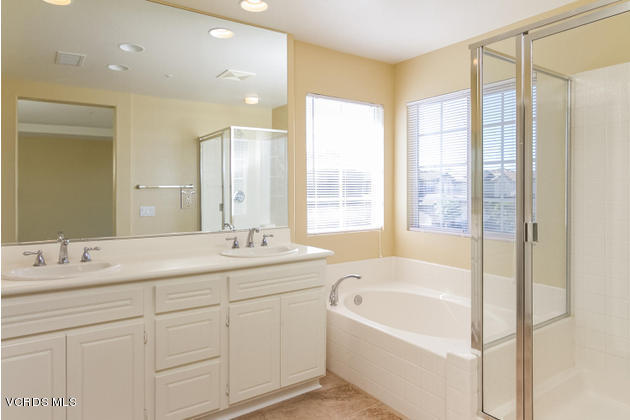 2001 Ribera Drive Oxnard, CA 93030 - Photo 12 of 20 a bathroom with a tub sink and mirror
