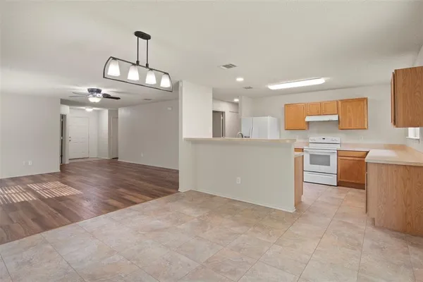 a view of a kitchen with a sink and cabinets