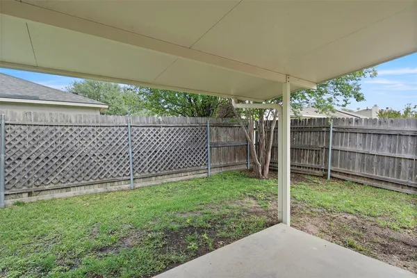 a view of a backyard with a garden