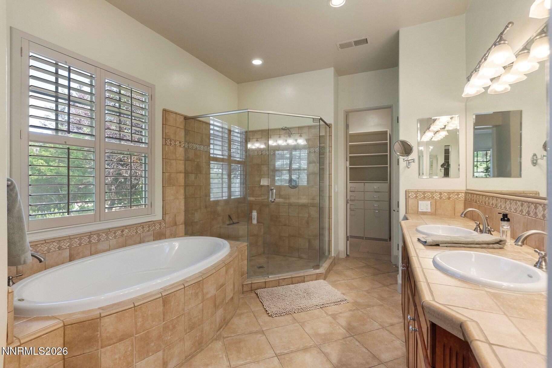 16925 Rue Du Parc Reno, NV 89511 - Photo 16 of 34 a bathroom with a bathtub and a sink