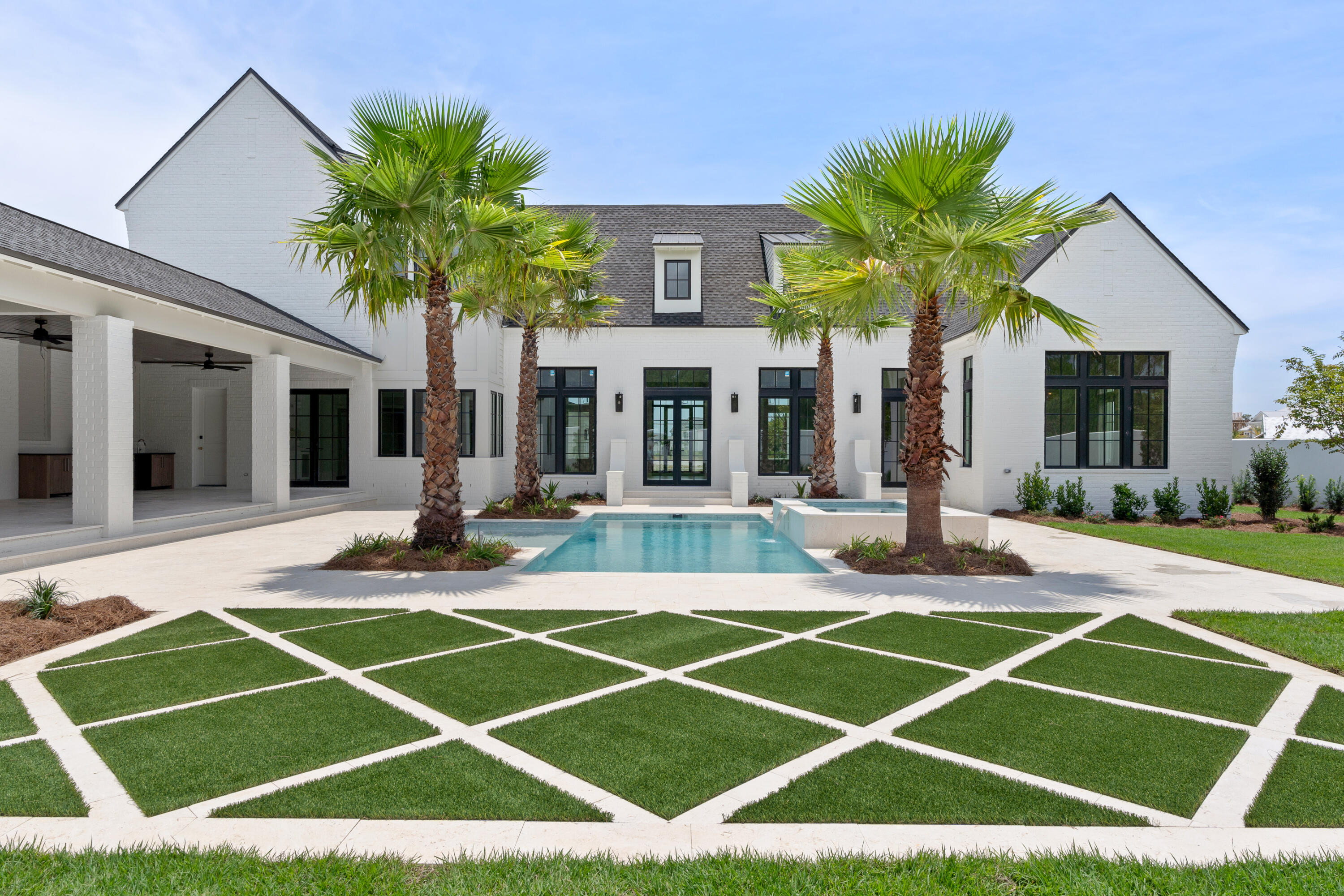 a front view of a house with swimming pool