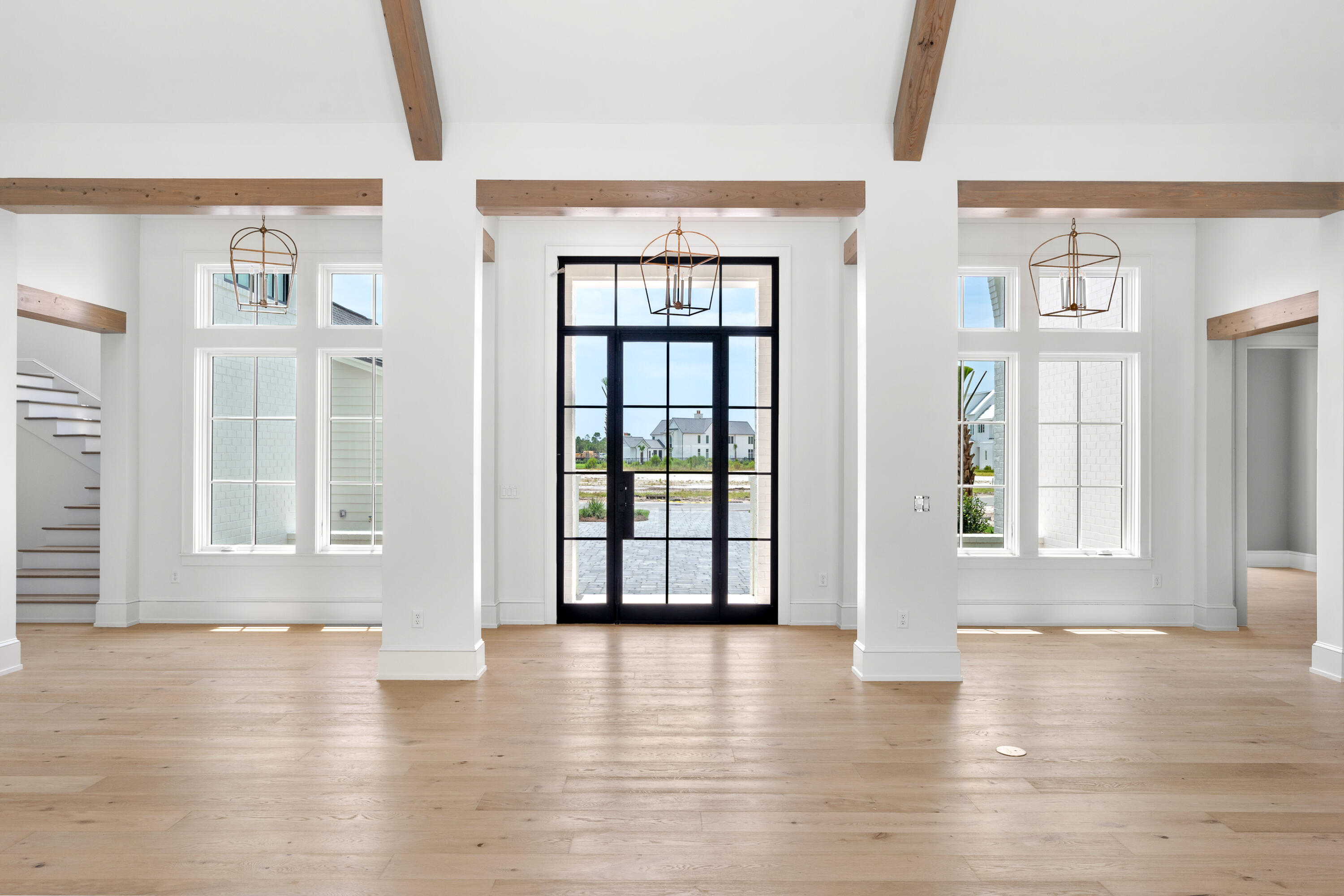 181 Quail Hollow Inlet Beach, FL 32461 - Photo 13 of 47 a view of an empty room with wooden floor and a window