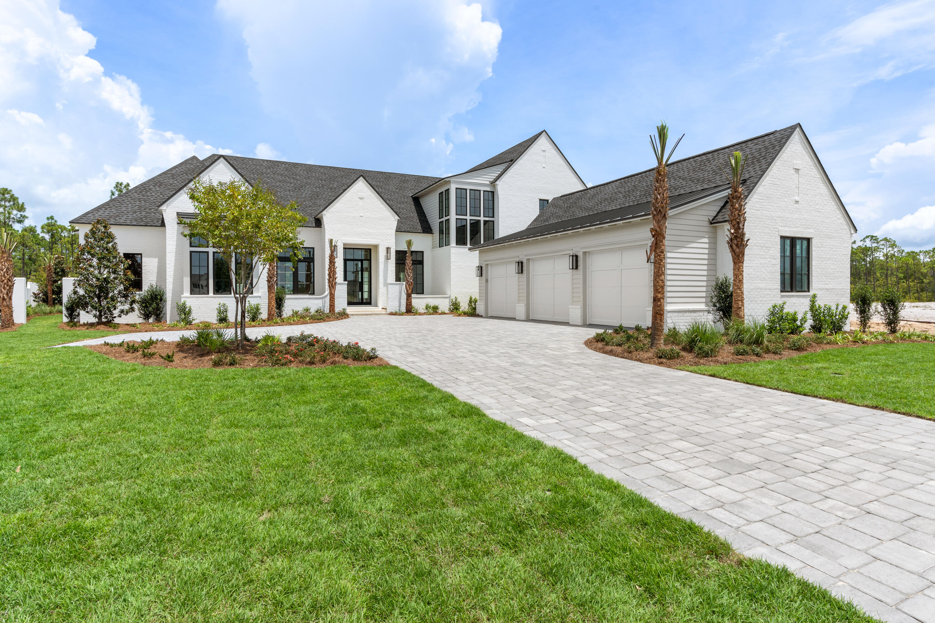 181 Quail Hollow Inlet Beach, FL 32461 - Photo 2 of 47 a front view of a house with a yard and outdoor seating
