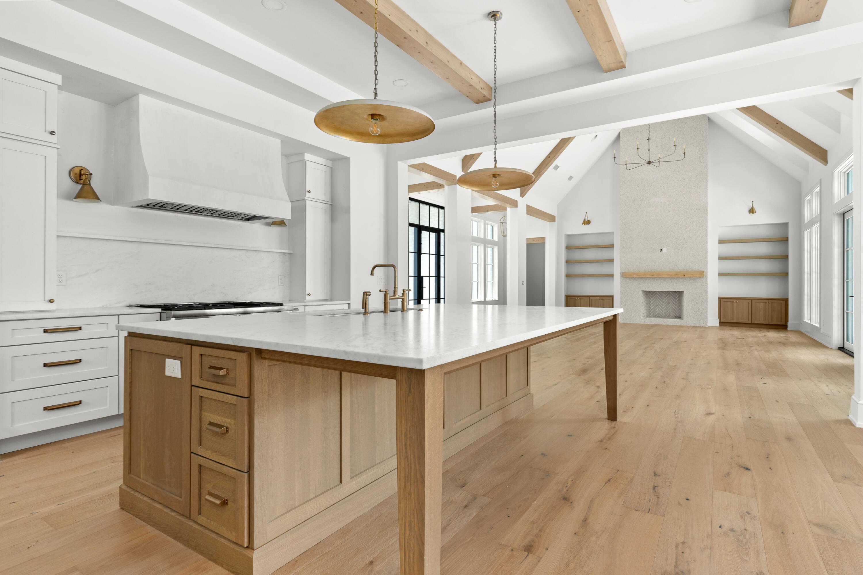 181 Quail Hollow Inlet Beach, FL 32461 - Photo 22 of 47 a kitchen with stainless steel appliances kitchen island wooden floors and center island