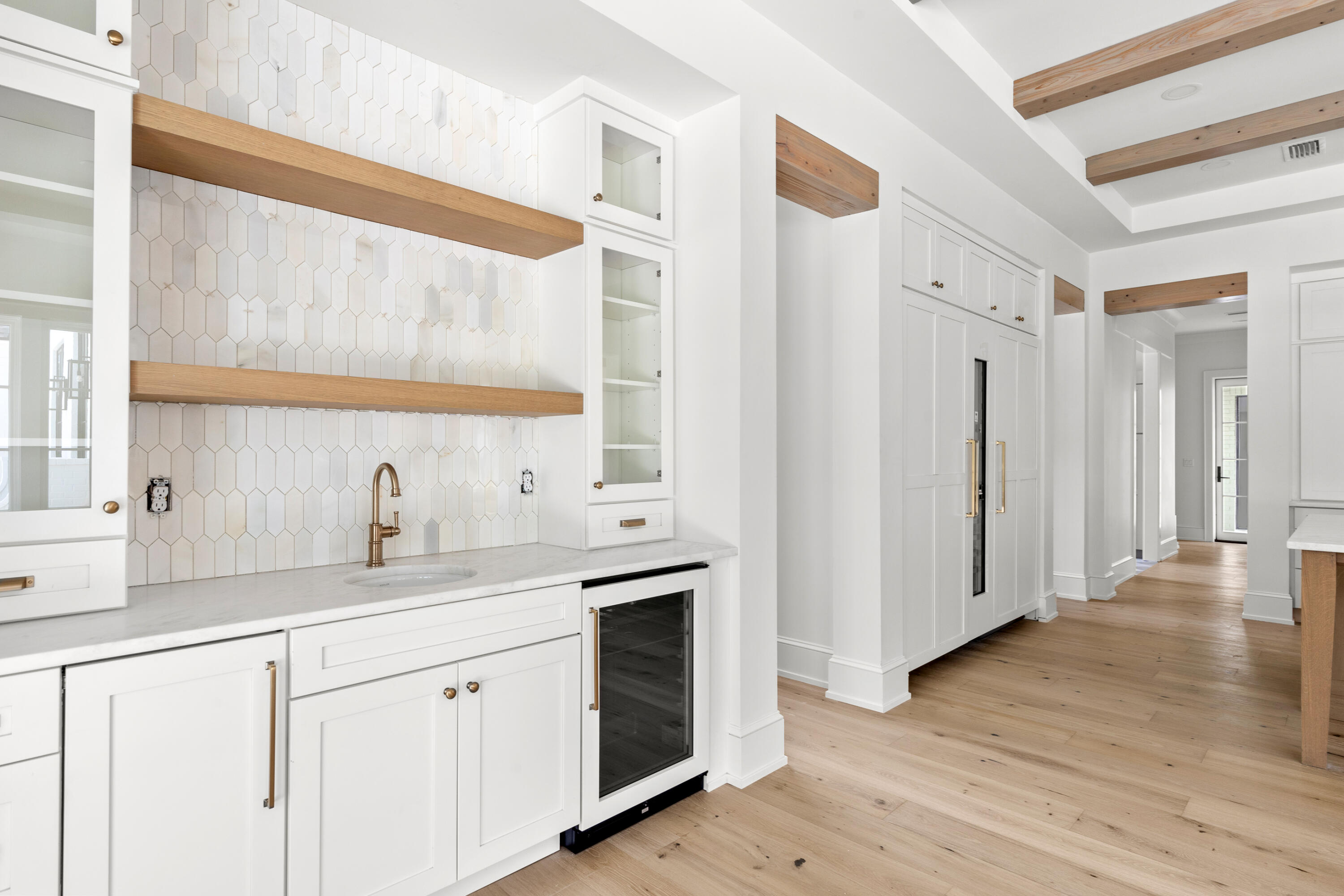 181 Quail Hollow Inlet Beach, FL 32461 - Photo 26 of 47 a view of a kitchen with wooden floor and electronic appliances