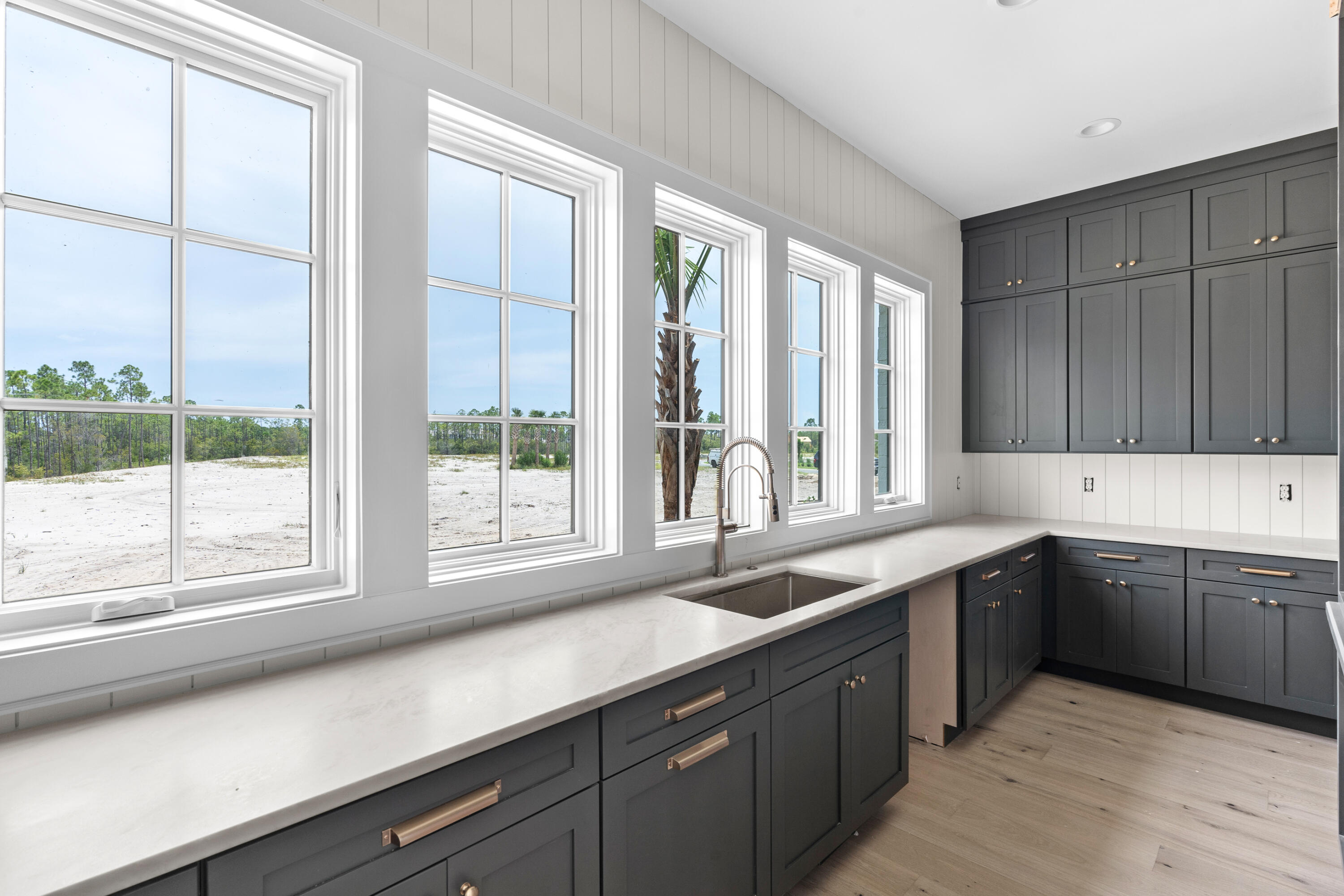 181 Quail Hollow Inlet Beach, FL 32461 - Photo 27 of 47 a kitchen with a sink and large window