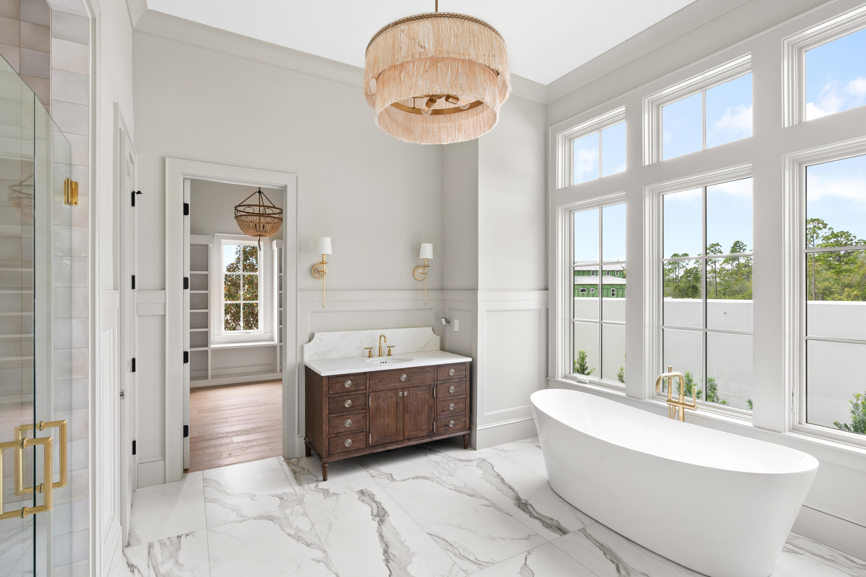 181 Quail Hollow Inlet Beach, FL 32461 - Photo 34 of 47 a bathroom with a tub a sink and a large mirror