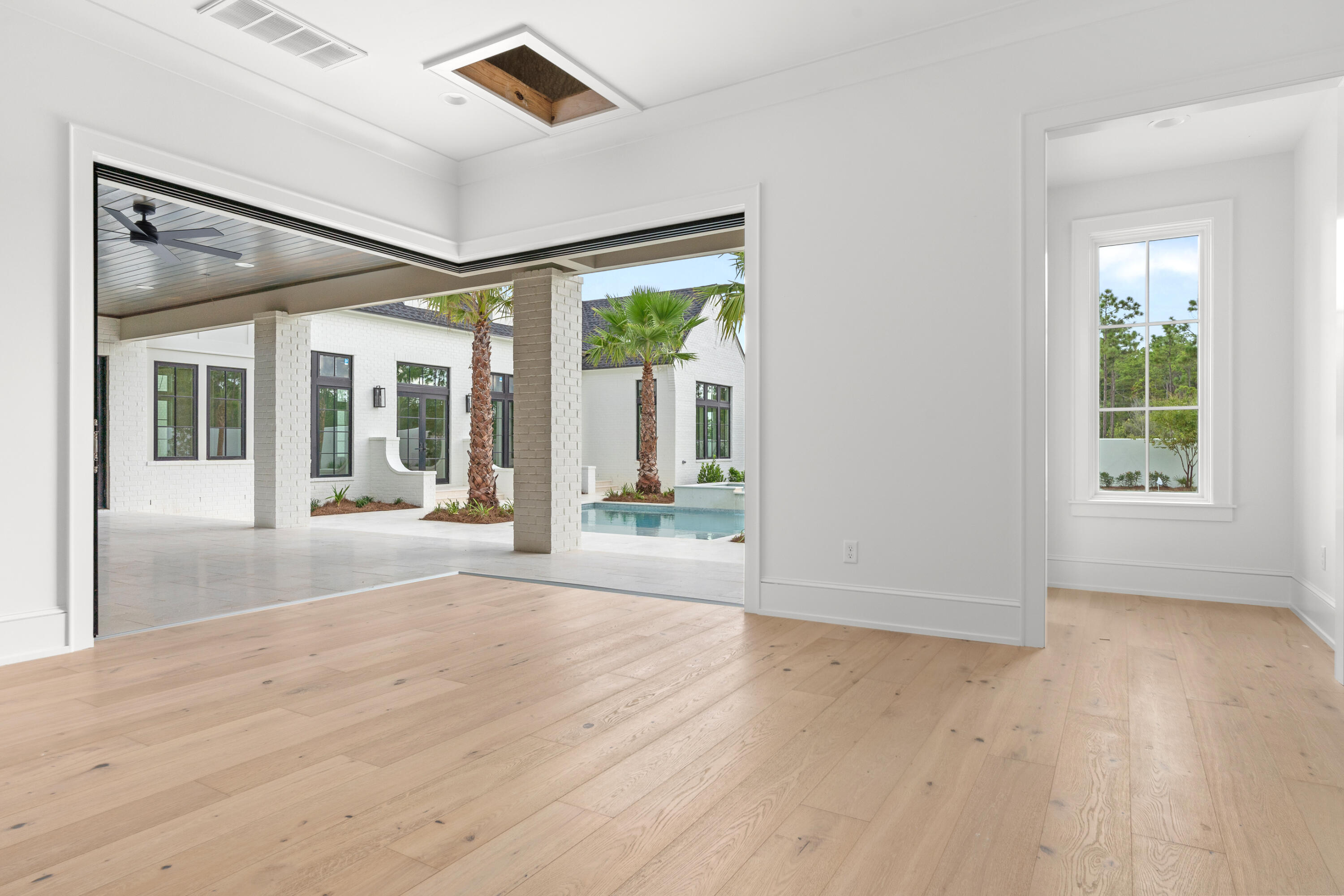 181 Quail Hollow Inlet Beach, FL 32461 - Photo 43 of 47 an empty room with wooden floor and windows