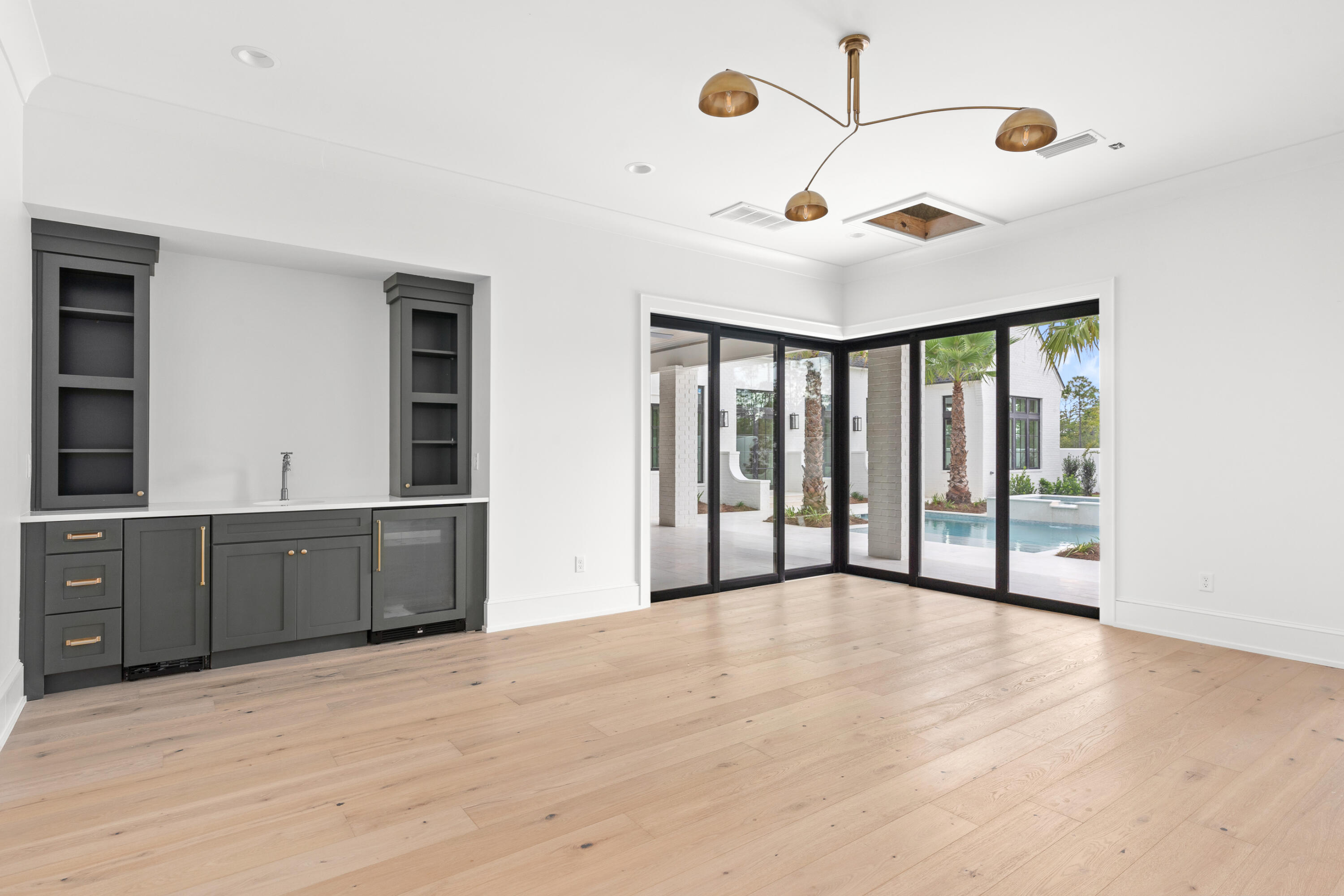 181 Quail Hollow Inlet Beach, FL 32461 - Photo 44 of 47 a view of an empty room with a window and kitchen view
