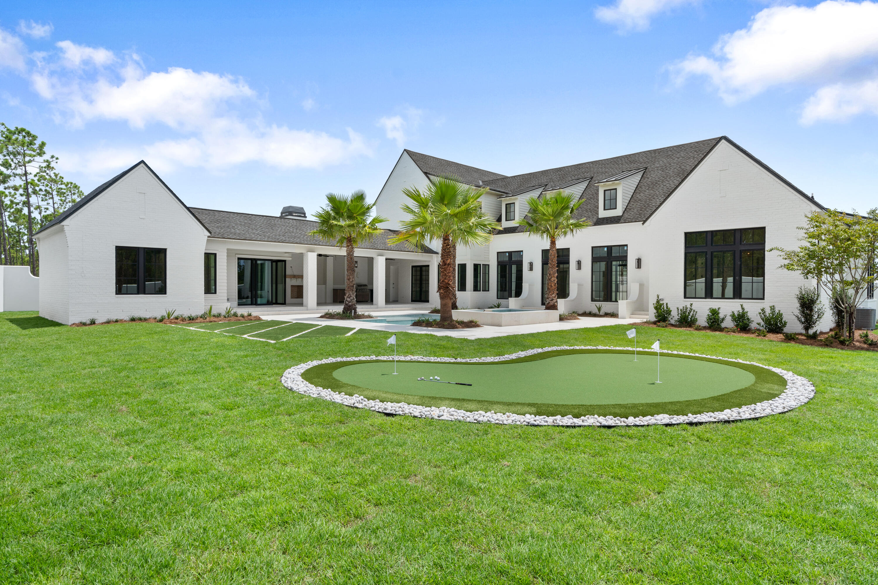 181 Quail Hollow Inlet Beach, FL 32461 - Photo 8 of 47 a front view of a house with a yard table and chairs