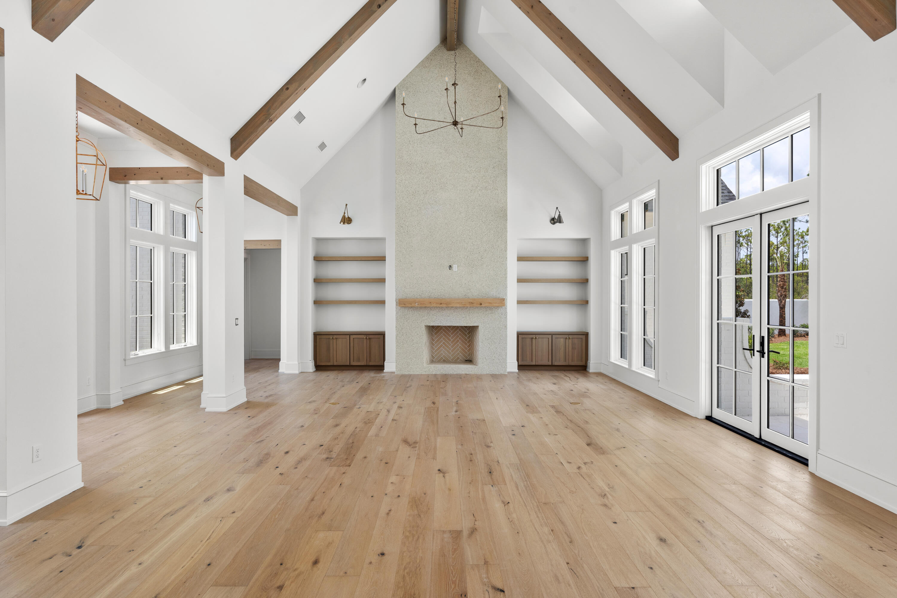 181 Quail Hollow Inlet Beach, FL 32461 - Photo 10 of 47 wooden floor in an empty room with a fireplace