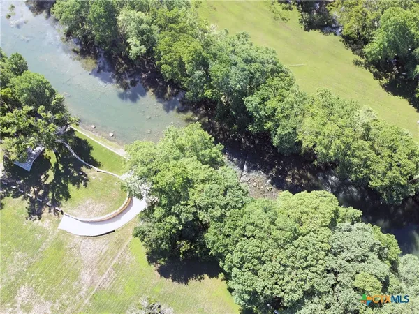 a backyard of a house with a yard and plants