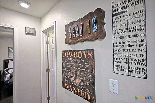 a view of a street with wall paintings on the wall