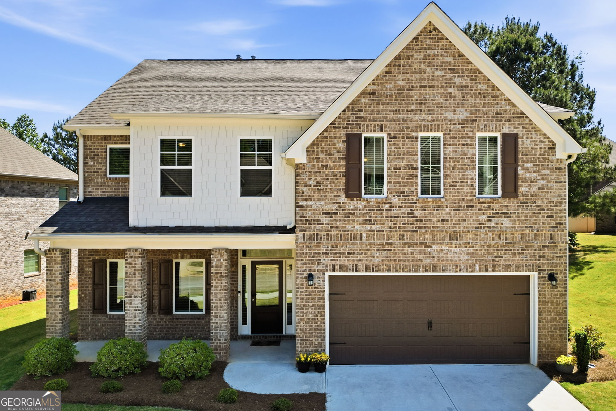 604 O'Brians Path McDonough, GA 30253 - Photo 1 of 41 a front view of a house with garden