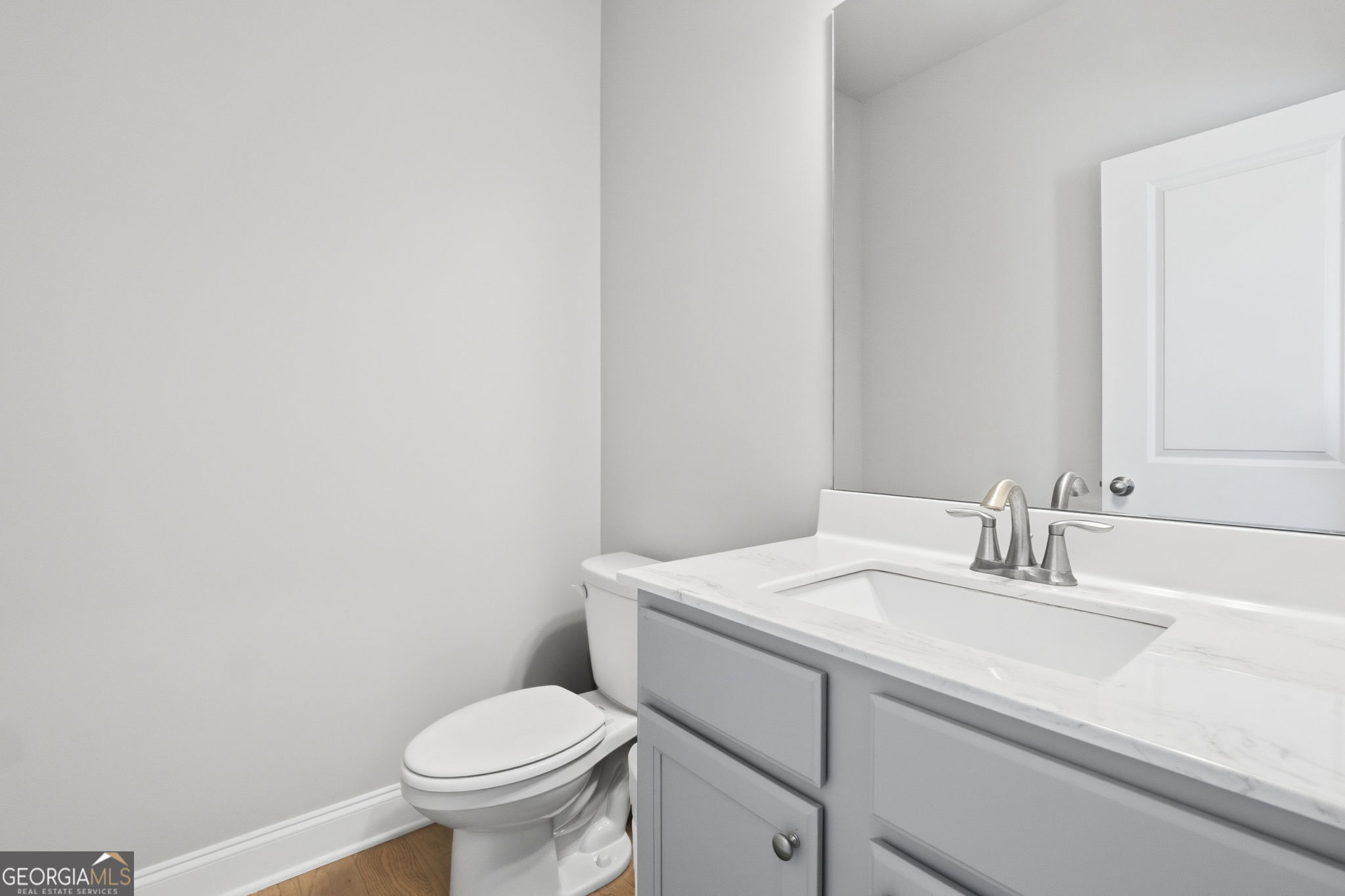 604 O'Brians Path McDonough, GA 30253 - Photo 14 of 41 a bathroom with a sink toilet and a mirror