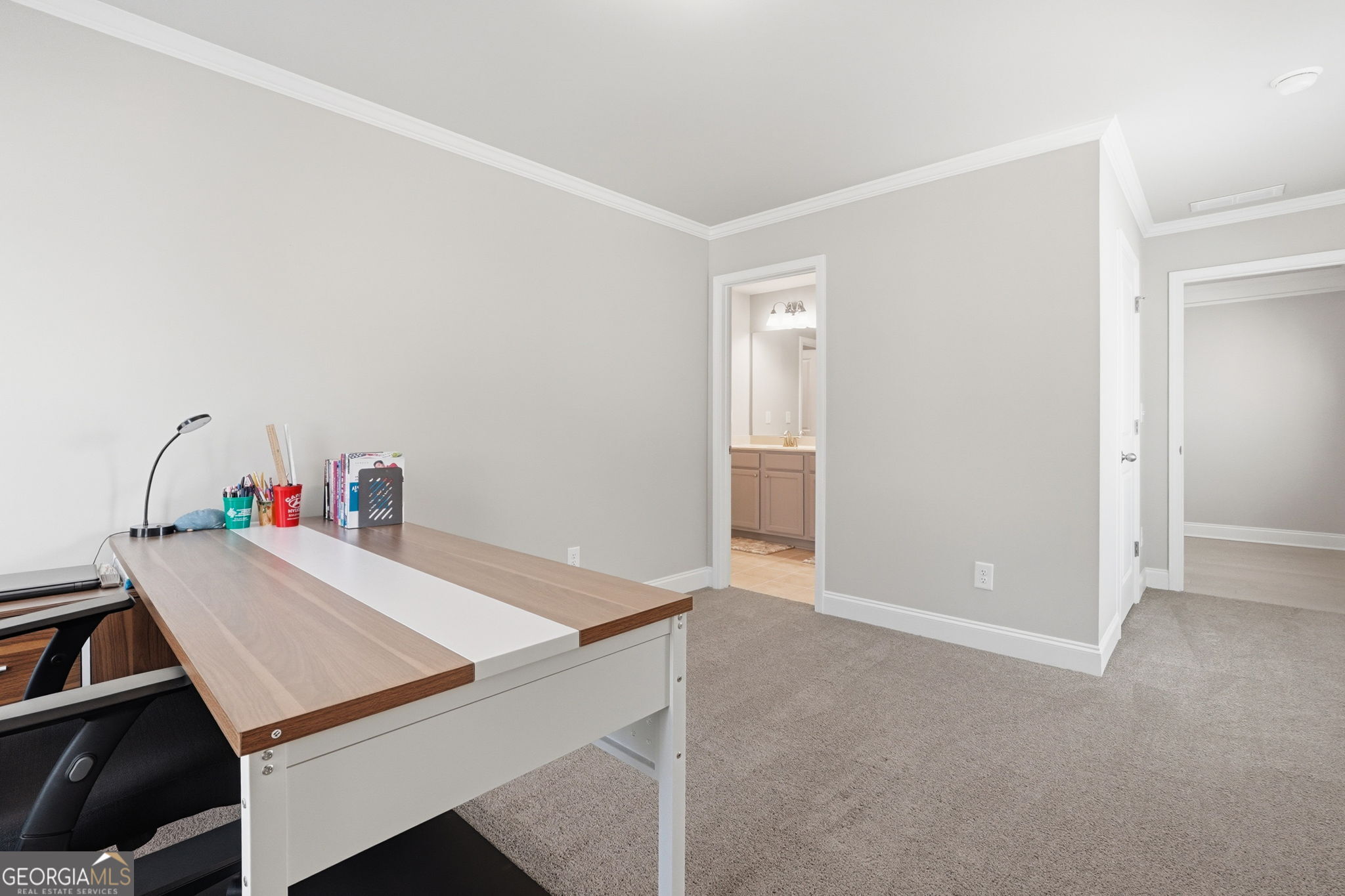 604 O'Brians Path McDonough, GA 30253 - Photo 17 of 41 a room with a table and workspace