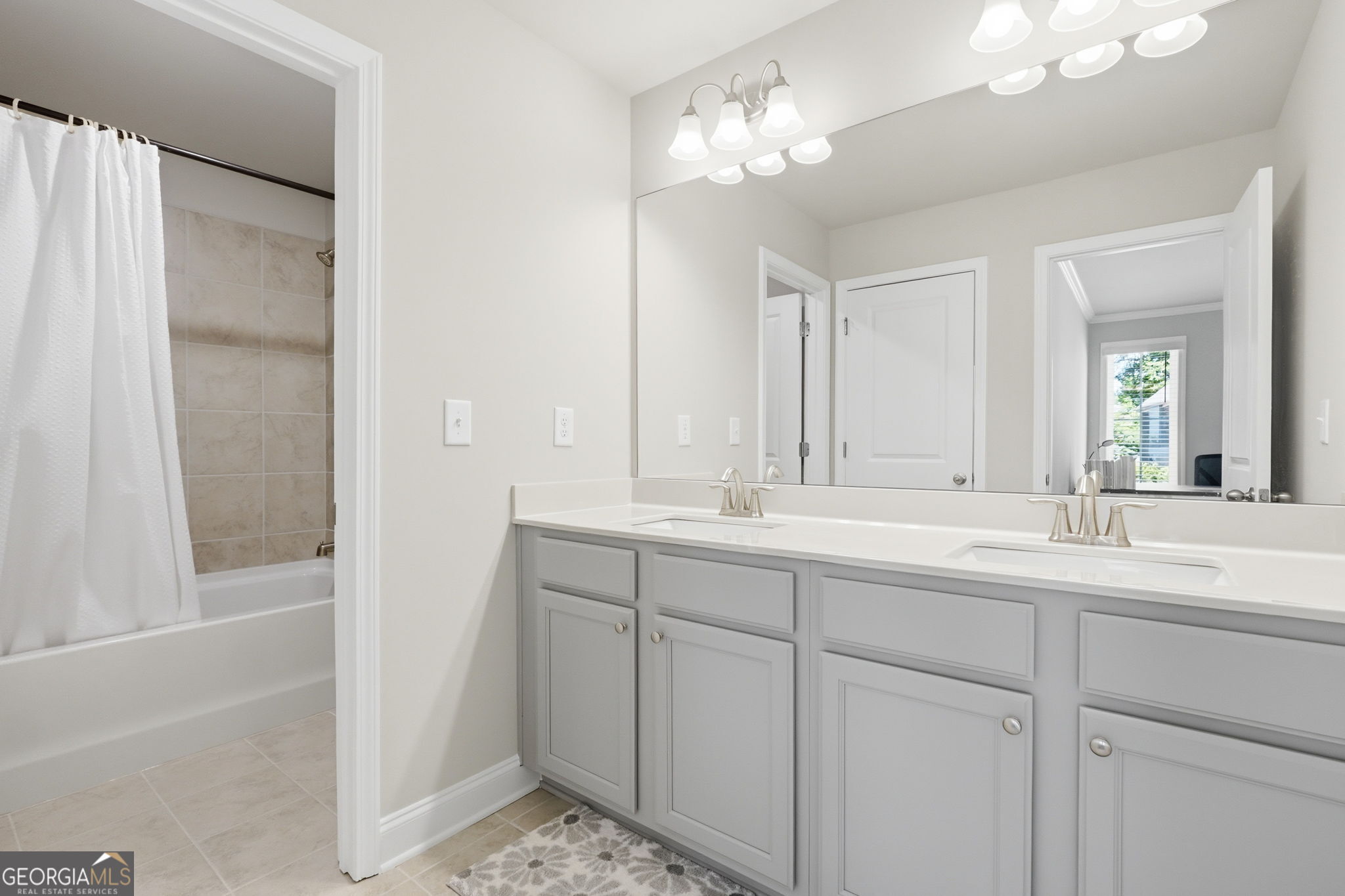 604 O'Brians Path McDonough, GA 30253 - Photo 18 of 41 a bathroom with a double vanity sink and a mirror