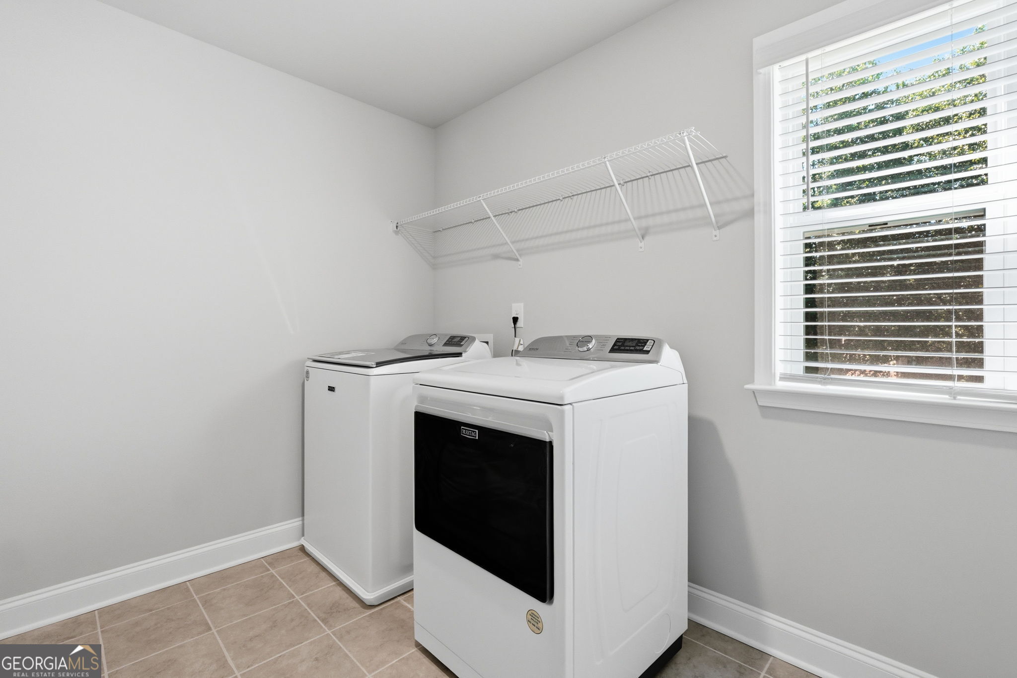 604 O'Brians Path McDonough, GA 30253 - Photo 19 of 41 a utility room with dryer and washer