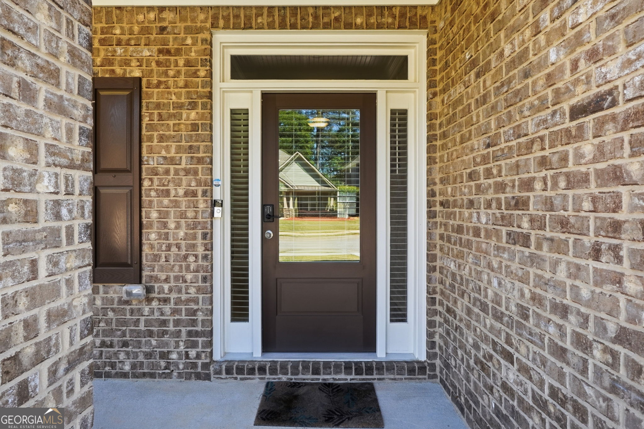 604 O'Brians Path McDonough, GA 30253 - Photo 2 of 41 a view of a brick house with a door