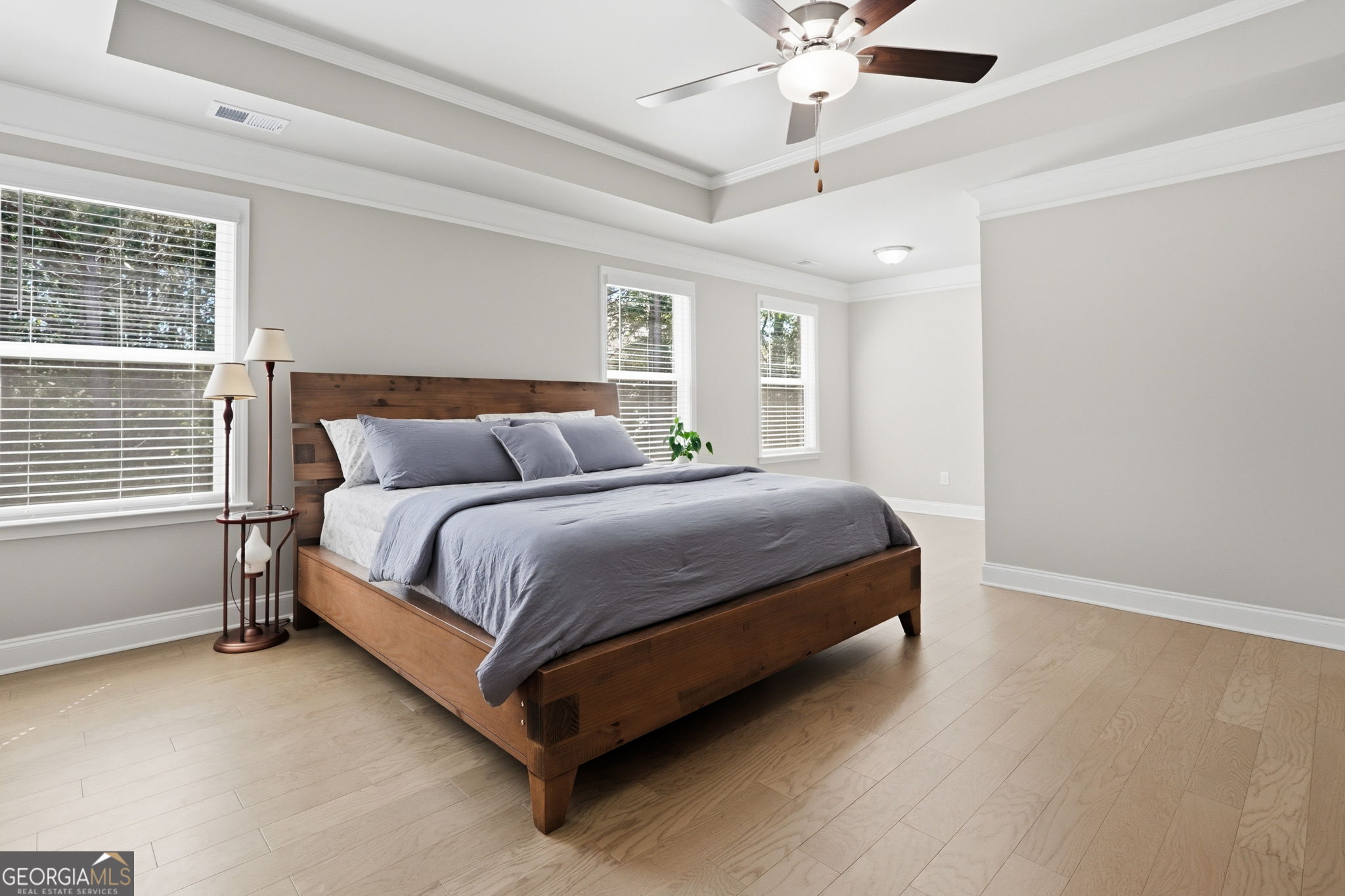 604 O'Brians Path McDonough, GA 30253 - Photo 21 of 41 a bedroom with a bed lamp and a window