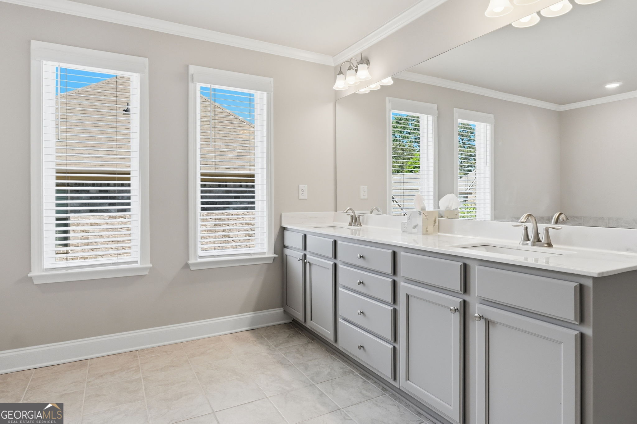 604 O'Brians Path McDonough, GA 30253 - Photo 23 of 41 a bathroom with double sink windows and a shower