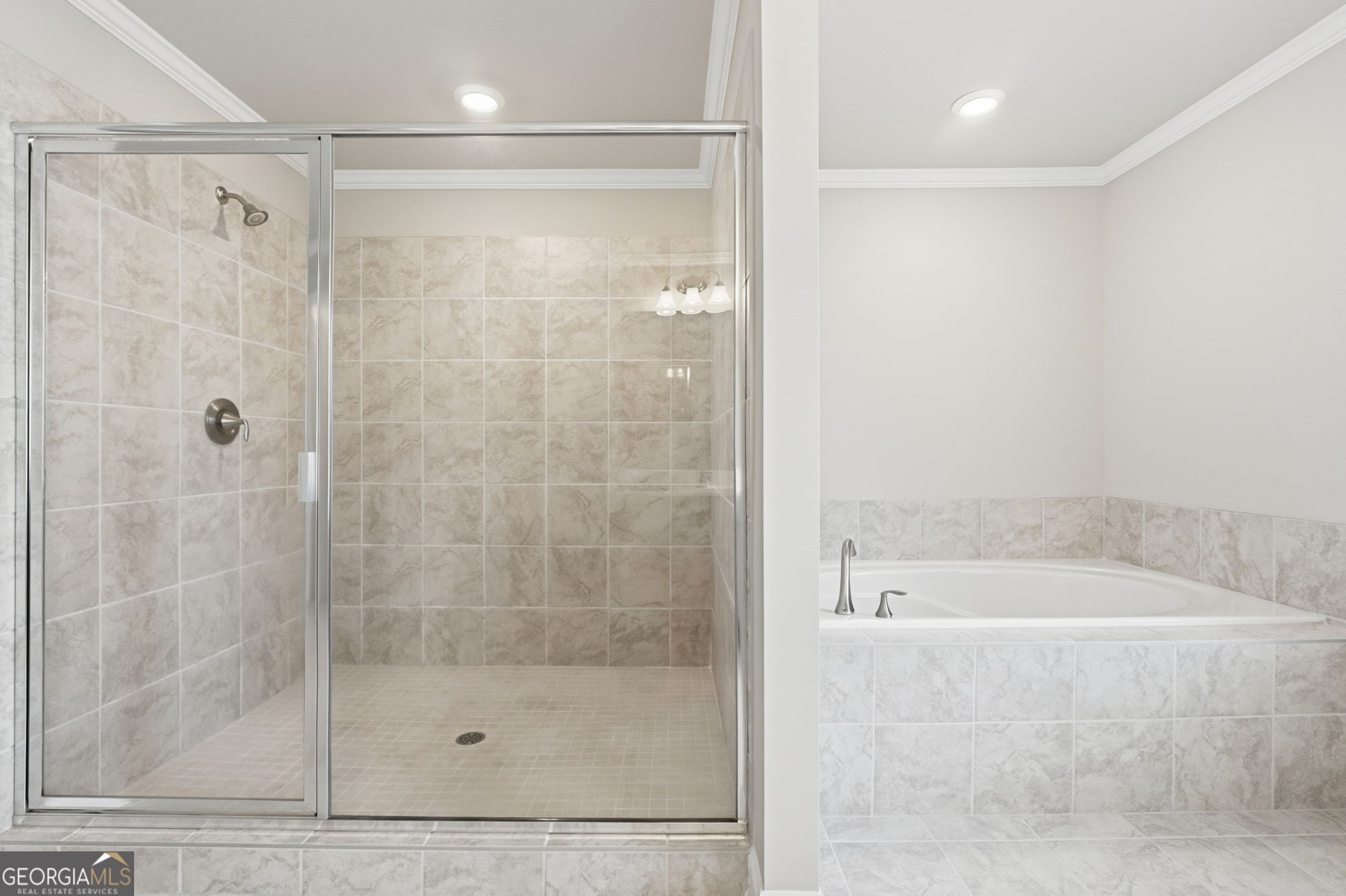 604 O'Brians Path McDonough, GA 30253 - Photo 24 of 41 a bathroom with a shower and a bathtub