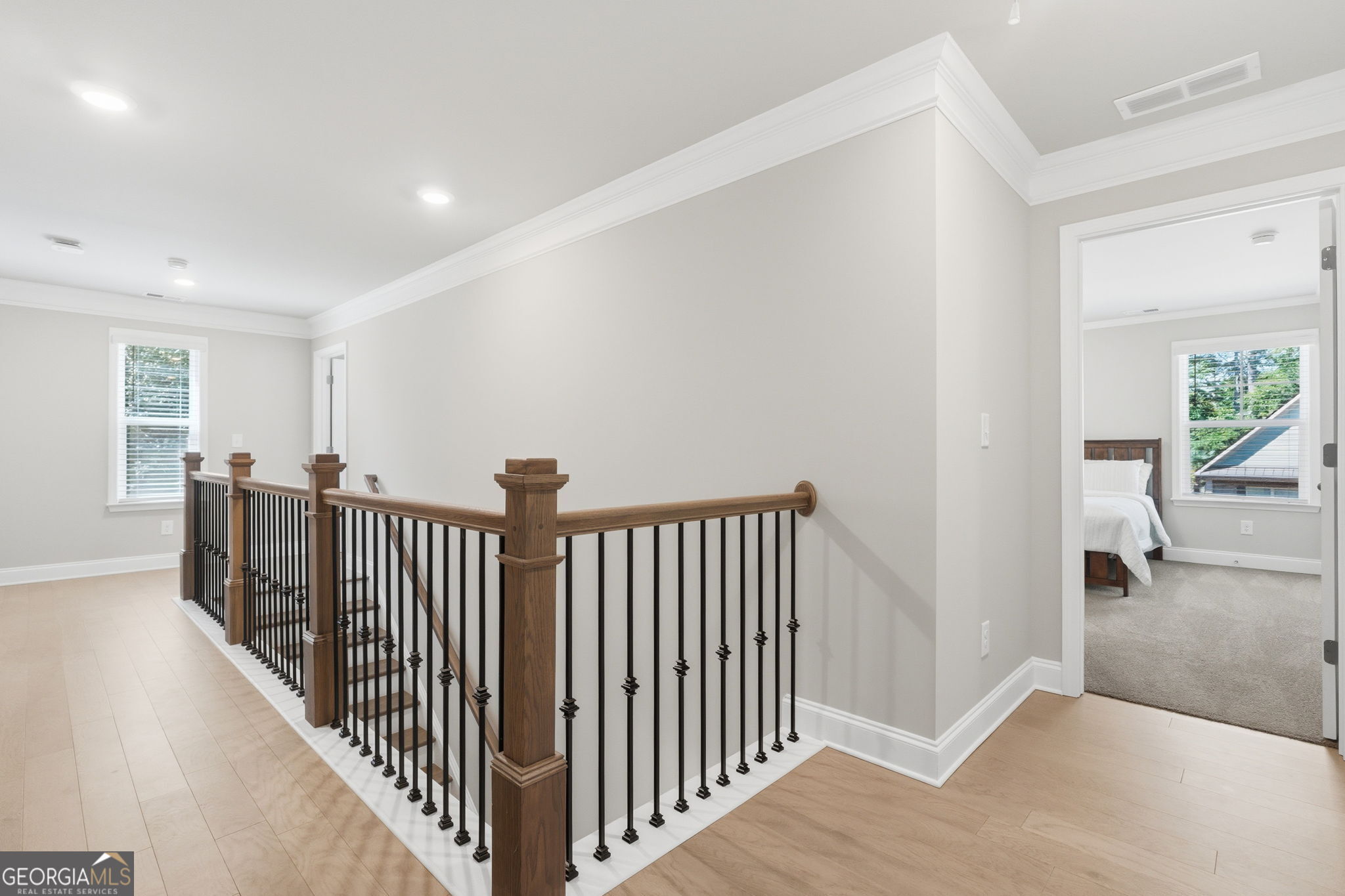 604 O'Brians Path McDonough, GA 30253 - Photo 25 of 41 a view of a hallway with wooden floor and windows