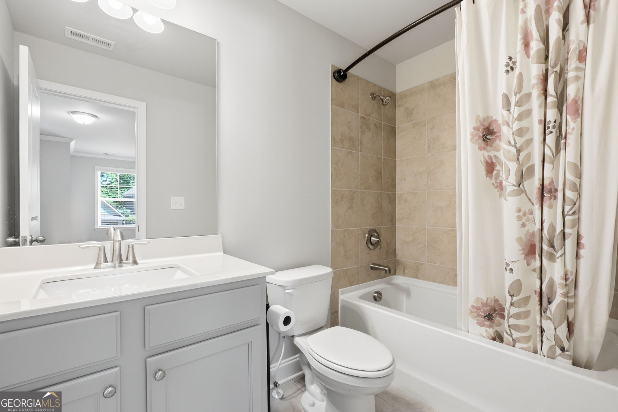 604 O'Brians Path McDonough, GA 30253 - Photo 28 of 41 a bathroom with a sink toilet and shower
