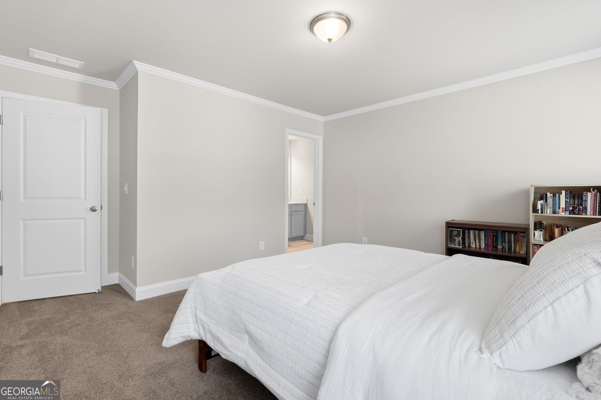 604 O'Brians Path McDonough, GA 30253 - Photo 30 of 41 a bedroom with a bed and a night stand