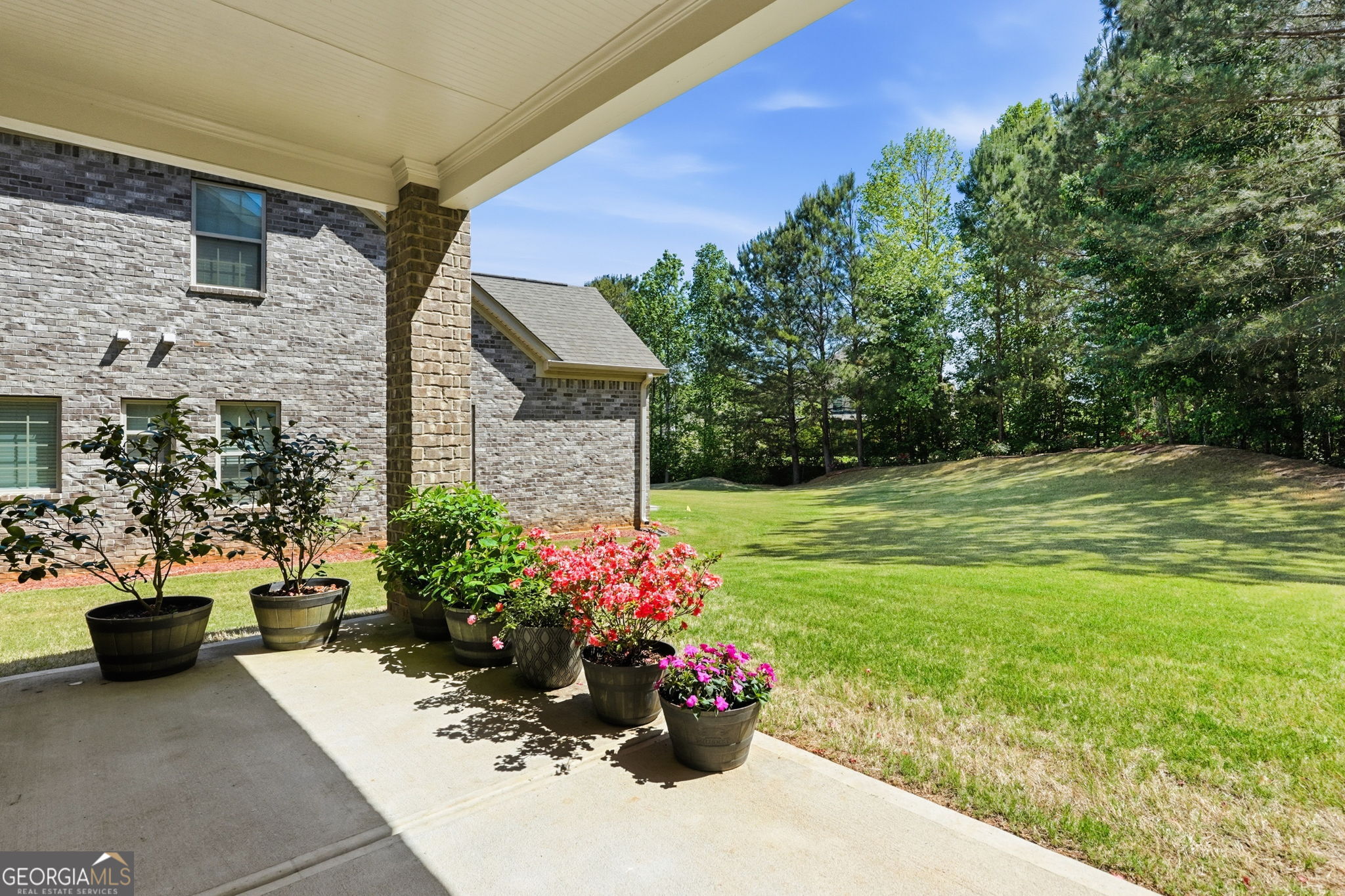 604 O'Brians Path McDonough, GA 30253 - Photo 31 of 41 a view of a garden with a fountain