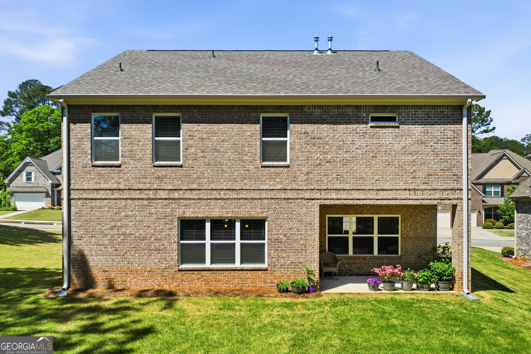 604 O'Brians Path McDonough, GA 30253 - Photo 32 of 41 a front view of a house with garden