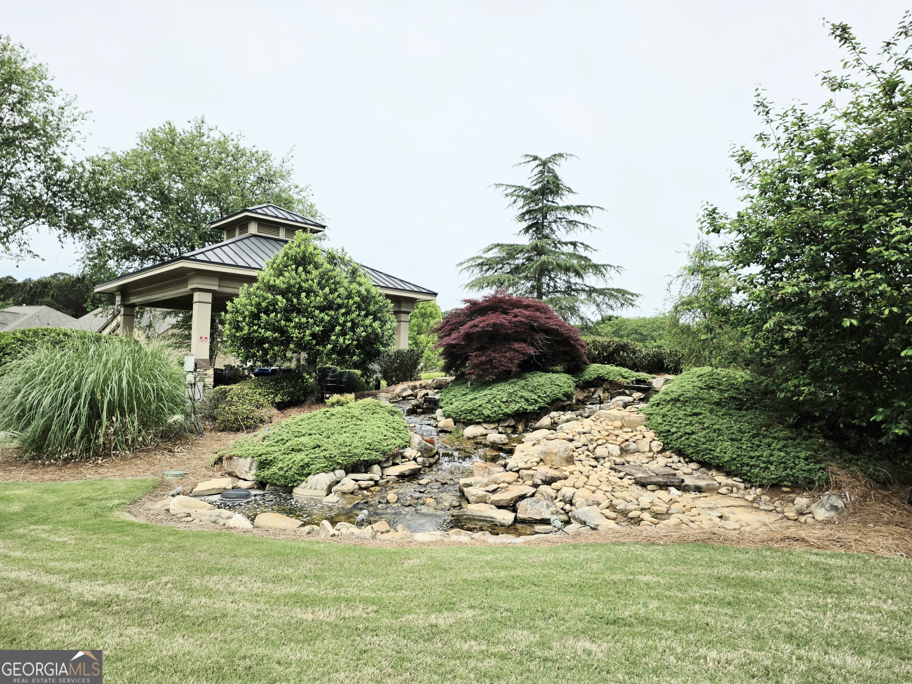 604 O'Brians Path McDonough, GA 30253 - Photo 37 of 41 a view of a garden with a fountain