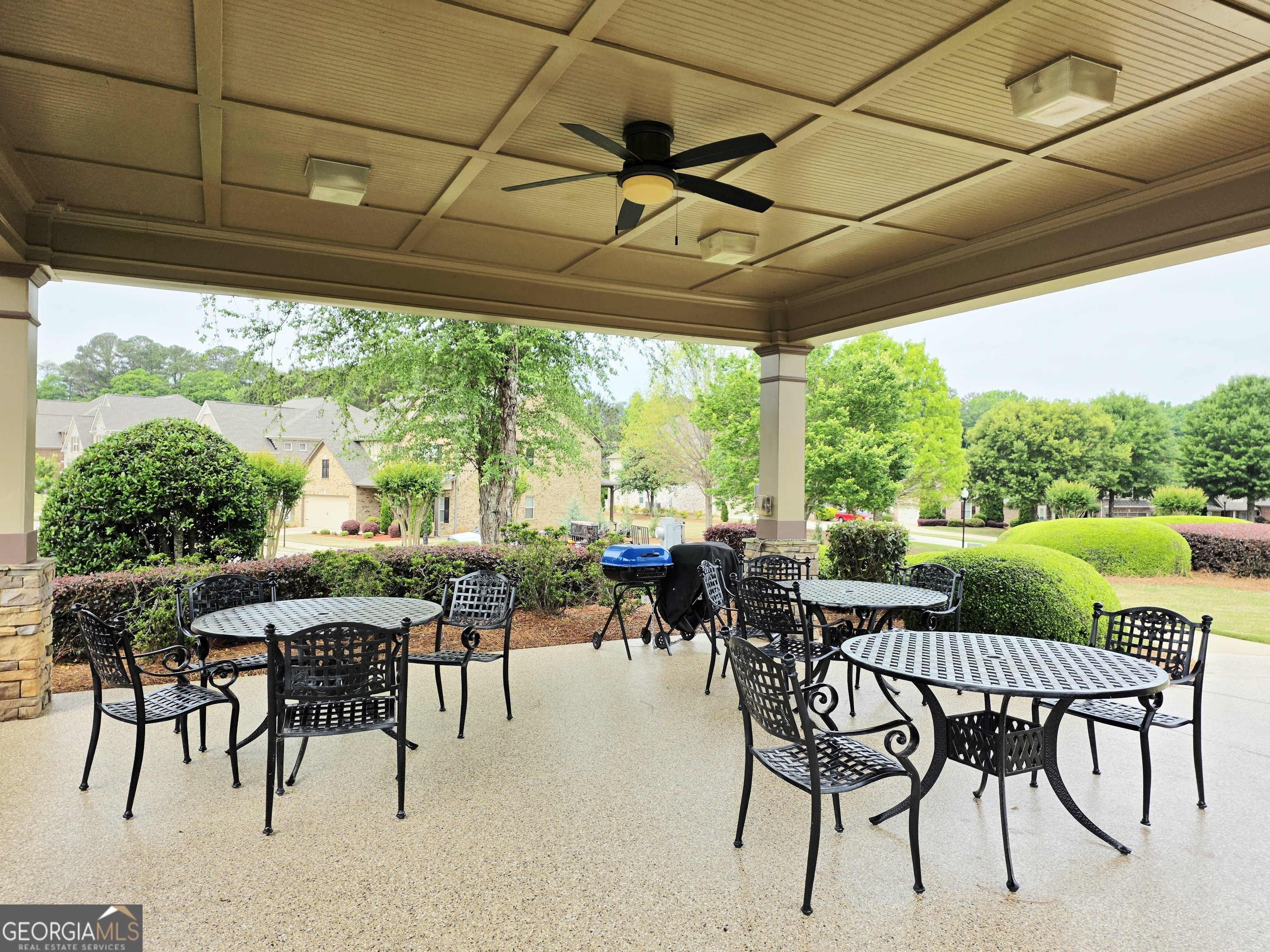 604 O'Brians Path McDonough, GA 30253 - Photo 39 of 41 a view of a patio with a table chairs and backyard
