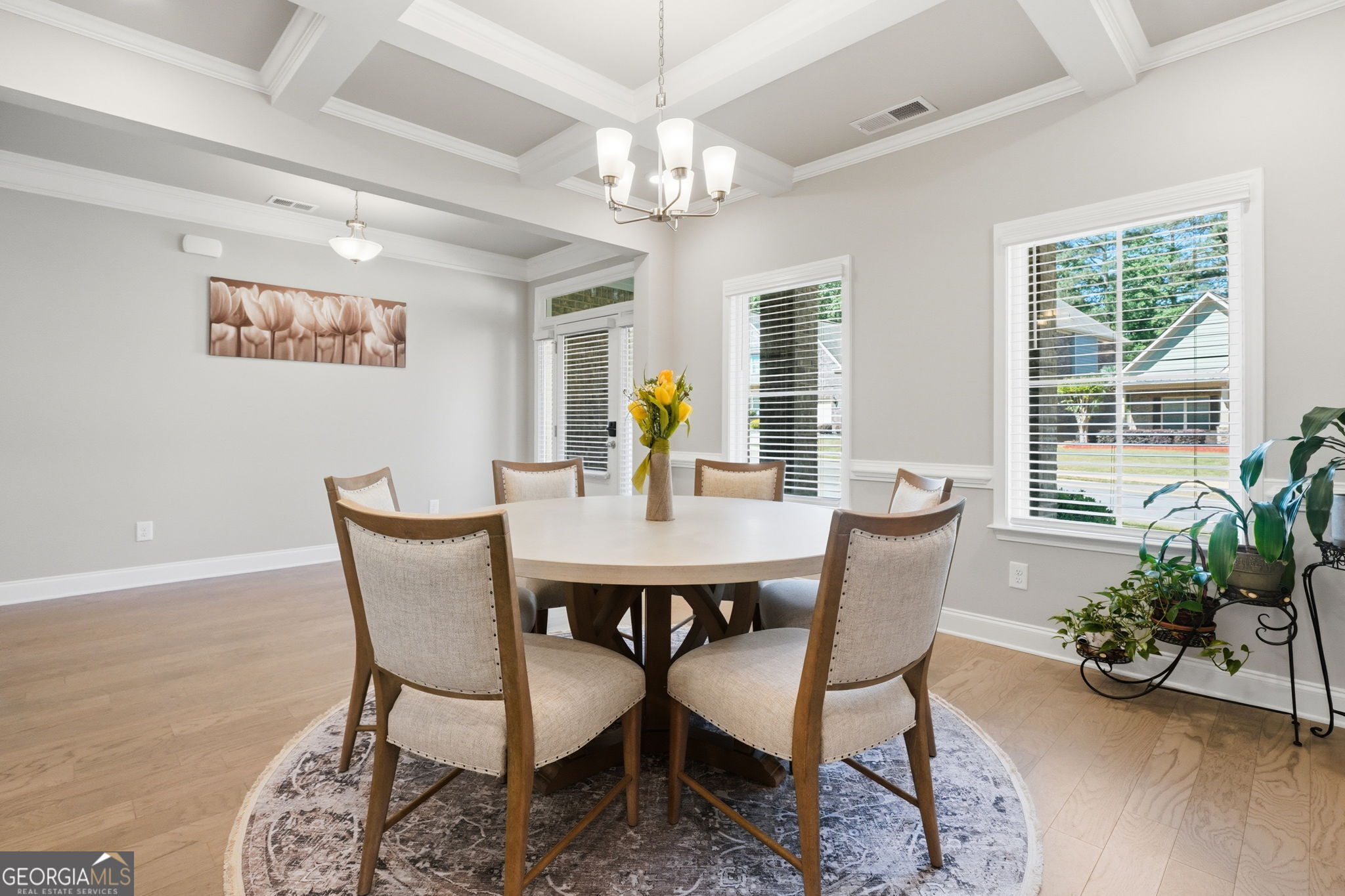 604 O'Brians Path McDonough, GA 30253 - Photo 6 of 41 a view of a dining room with furniture window and wooden floor