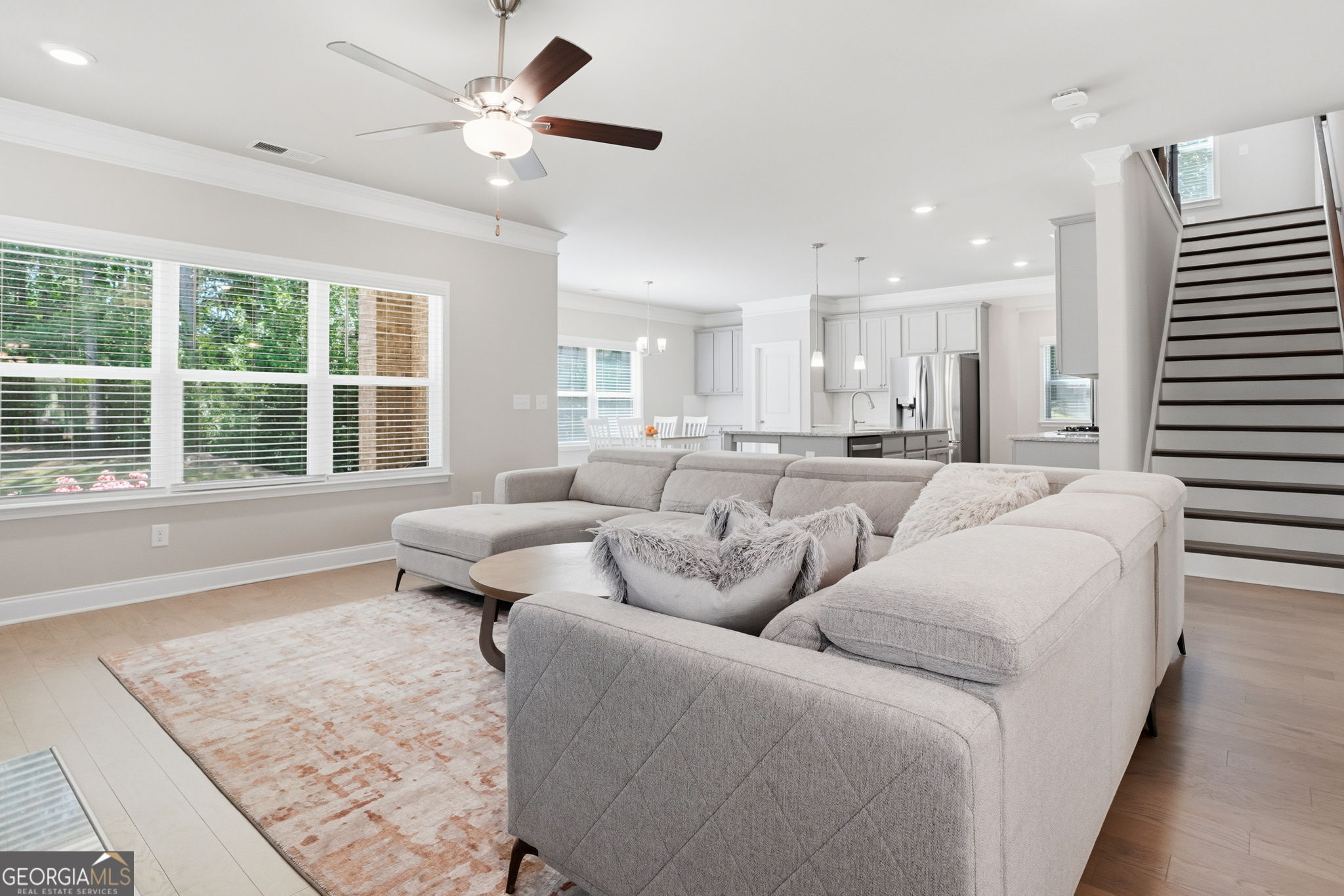 604 O'Brians Path McDonough, GA 30253 - Photo 7 of 41 a living room with furniture and a large window