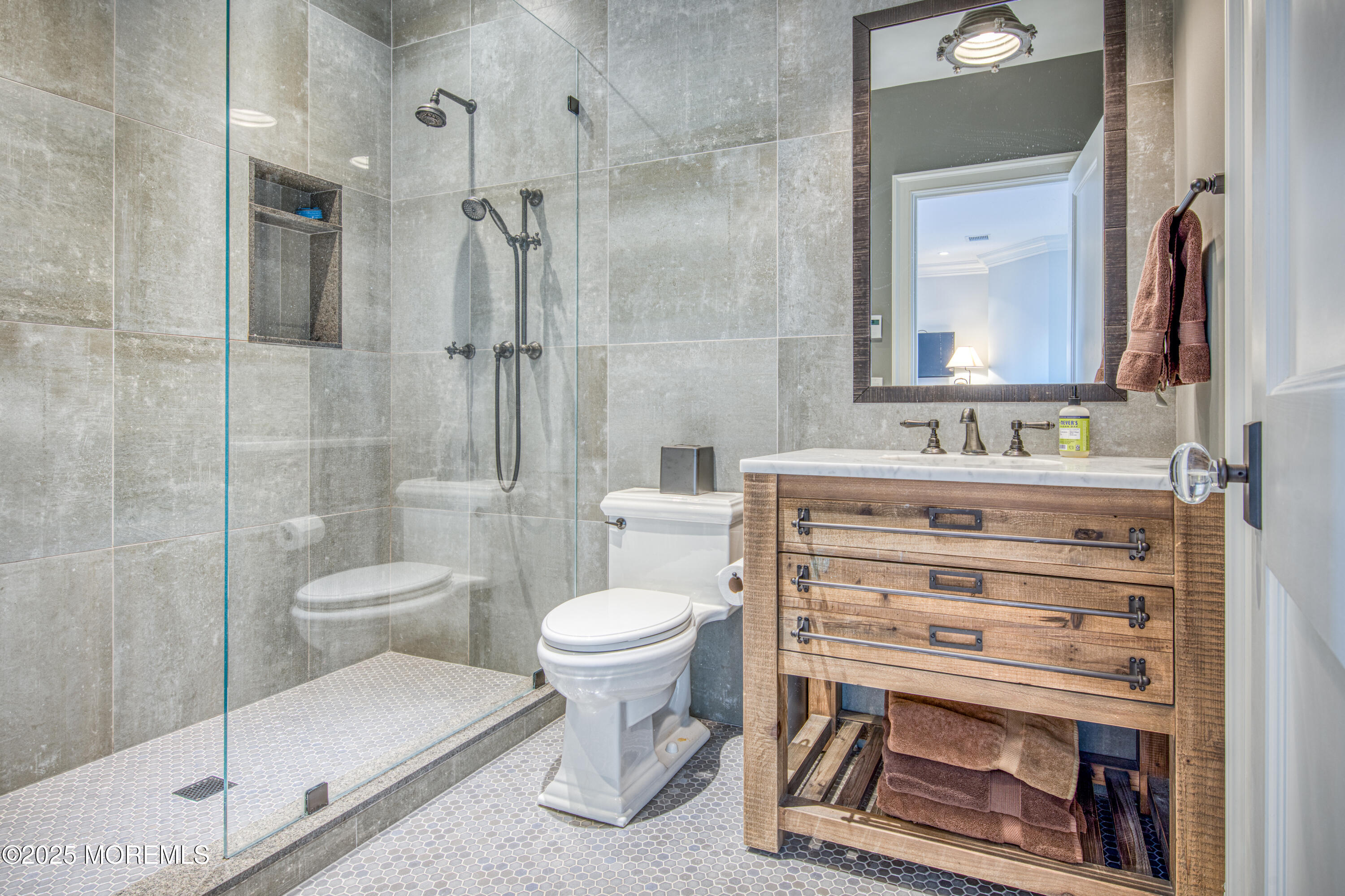 0 Wilson Circle Rumson, NJ 07760 - Photo 40 of 74 a bathroom with a sink toilet a mirror and shower