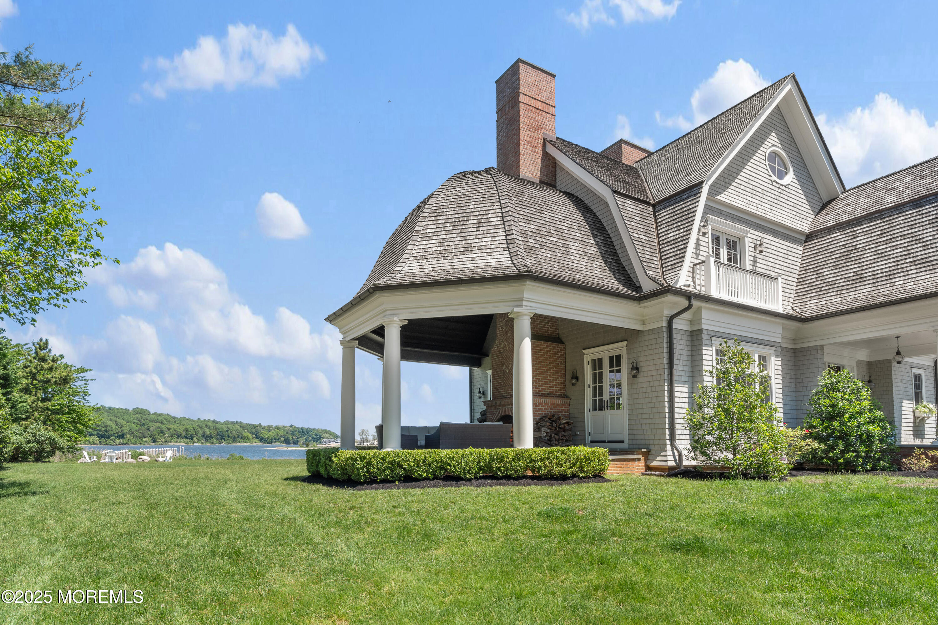 0 Wilson Circle Rumson, NJ 07760 - Photo 5 of 74 a front view of a house with a garden