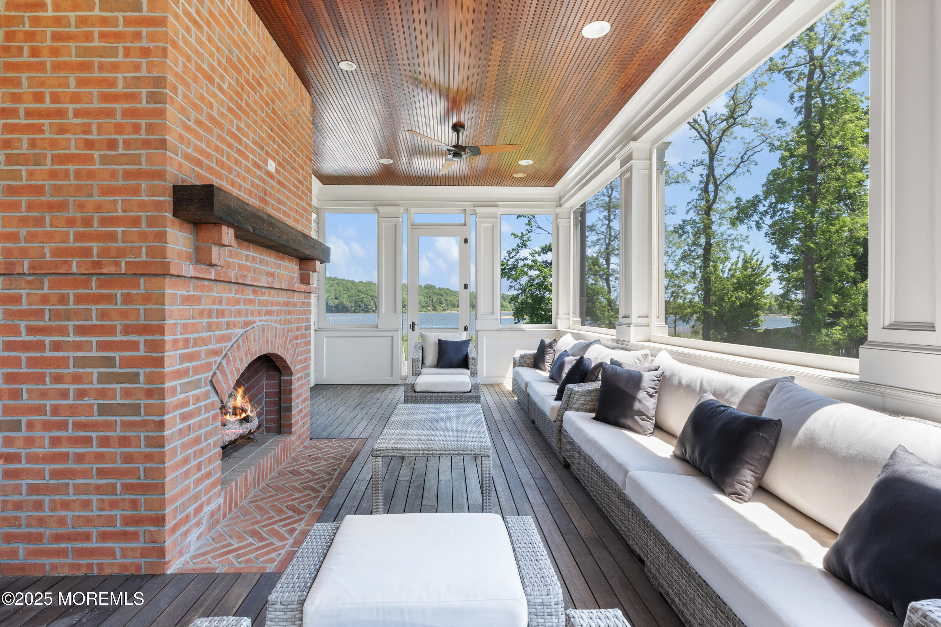 0 Wilson Circle Rumson, NJ 07760 - Photo 56 of 74 a living room with furniture fireplace and a floor to ceiling window