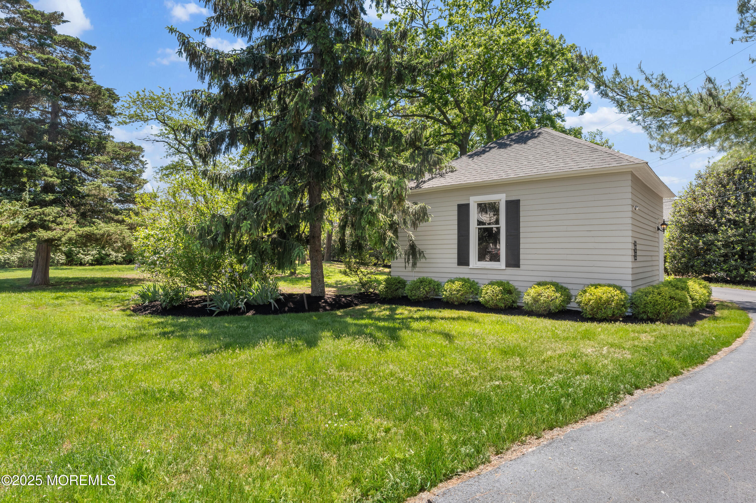 0 Wilson Circle Rumson, NJ 07760 - Photo 59 of 74 a front view of a house with a garden