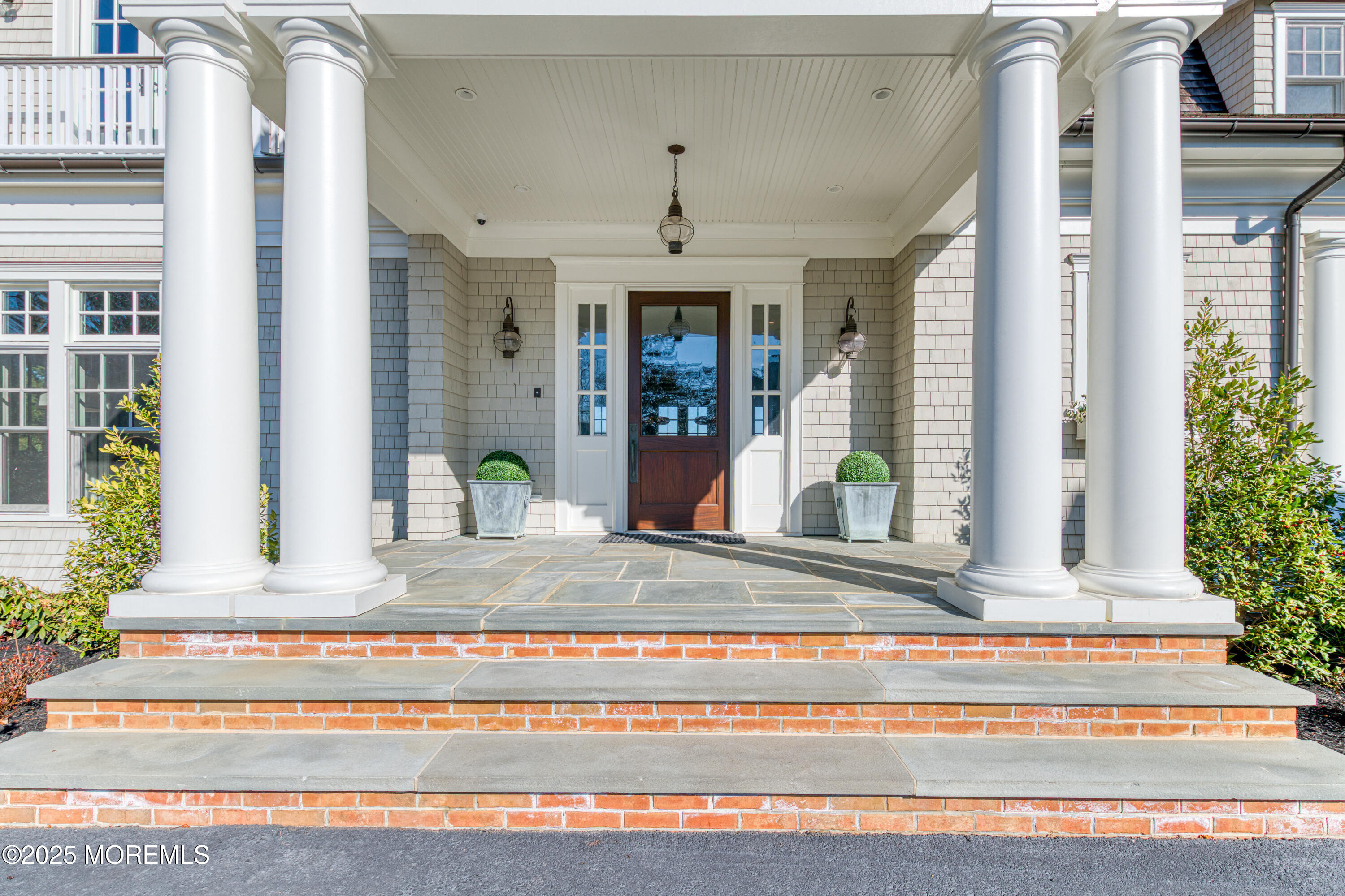 0 Wilson Circle Rumson, NJ 07760 - Photo 6 of 74 a view of a house with potted plants and a fountain