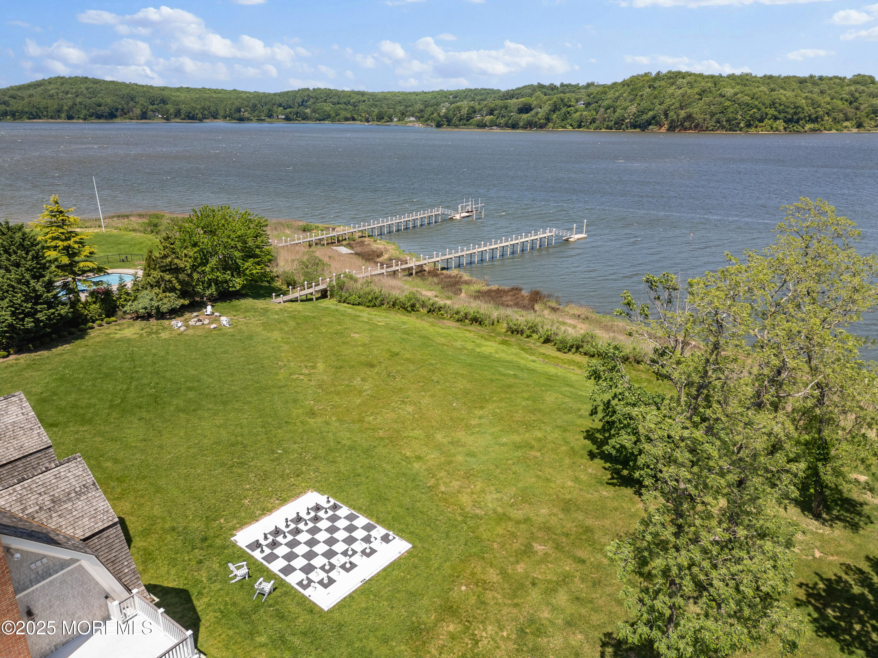0 Wilson Circle Rumson, NJ 07760 - Photo 65 of 74 a view of a lake with a mountain in the background