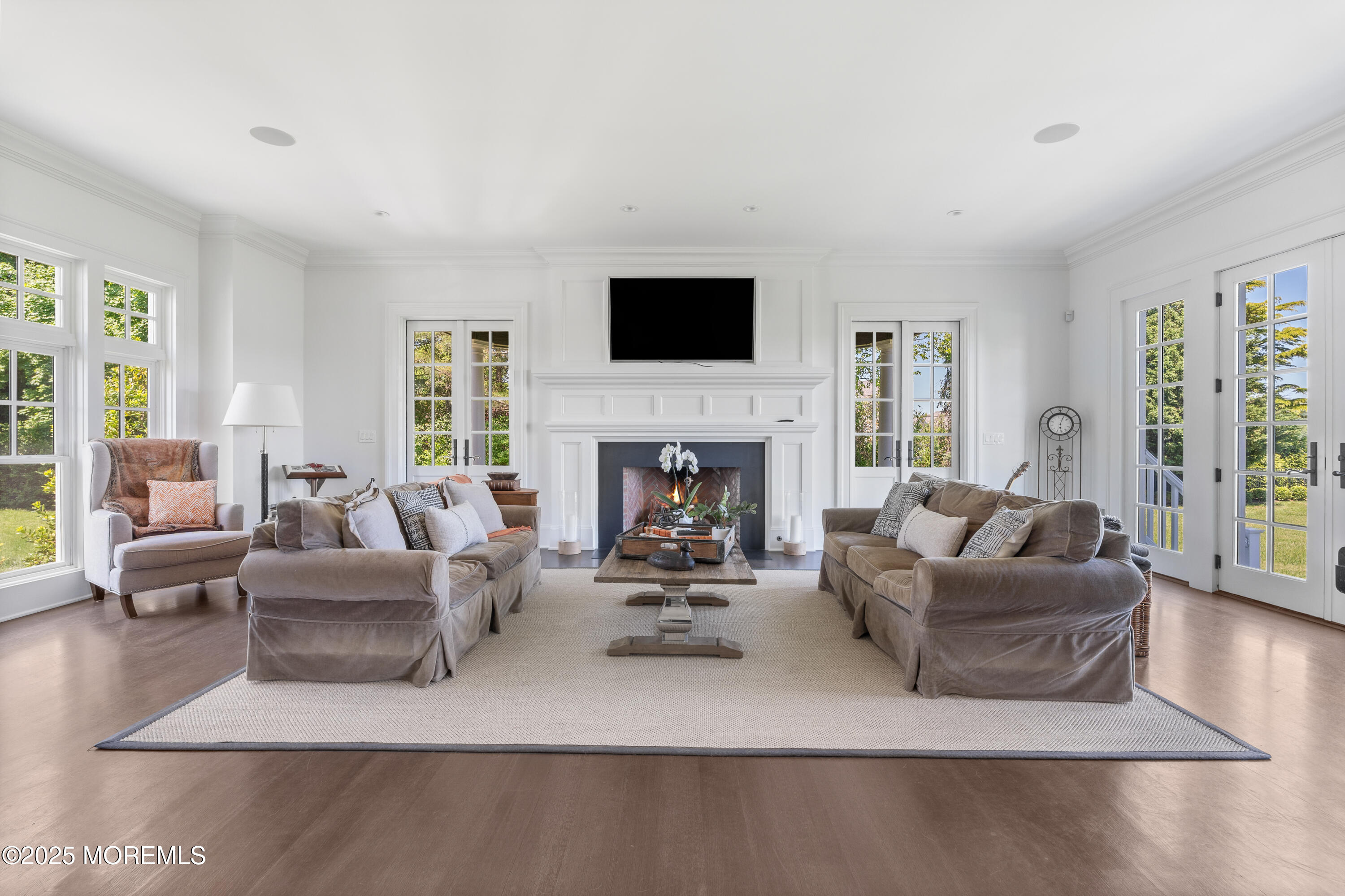 0 Wilson Circle Rumson, NJ 07760 - Photo 10 of 74 a living room with furniture flat screen tv and a fireplace