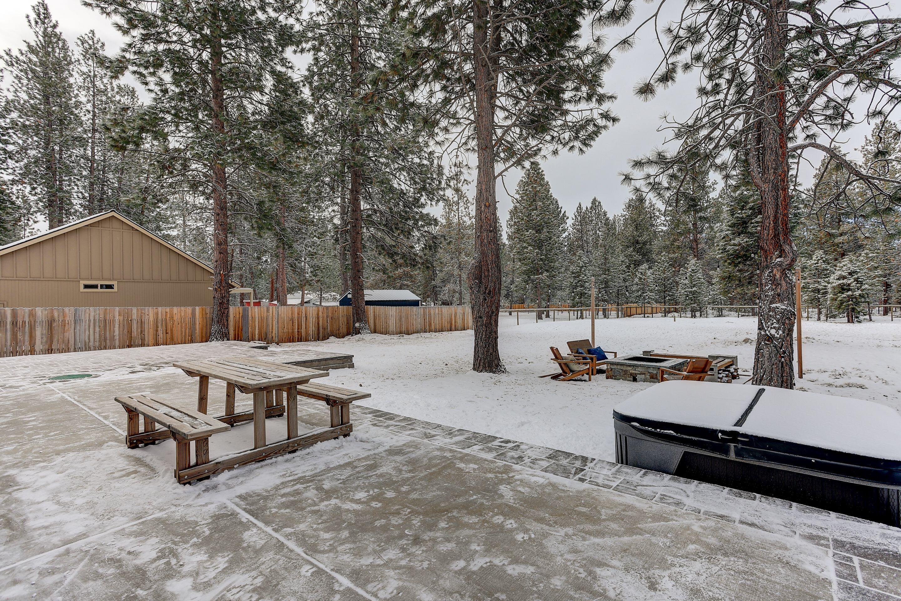 19047 Pumice Butte Road Bend, OR 97702 - Photo 9 of 38 a view of a roof deck with wooden fence and a bench