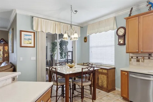 a view of a dining room with furniture and window