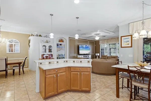 a large kitchen with a table and chairs