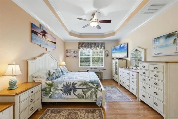 a bedroom with a bed dresser and a window