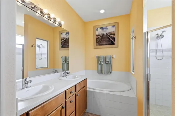 a bathroom with a bathtub and a shower