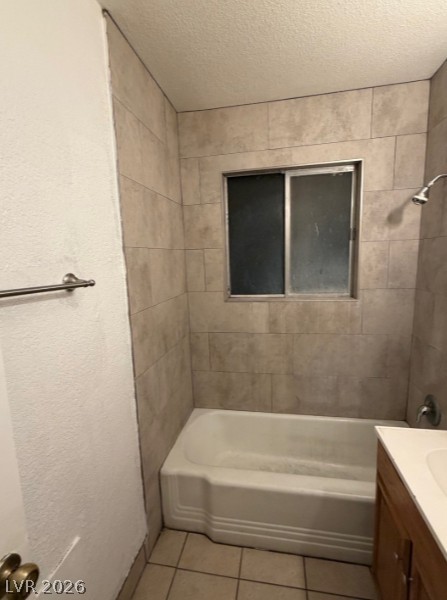 521 North Decatur Boulevard, Unit B Las Vegas, NV 89107 - Photo 9 of 17 A well-maintained bathroom with tiled shower walls and a clean bathtub.