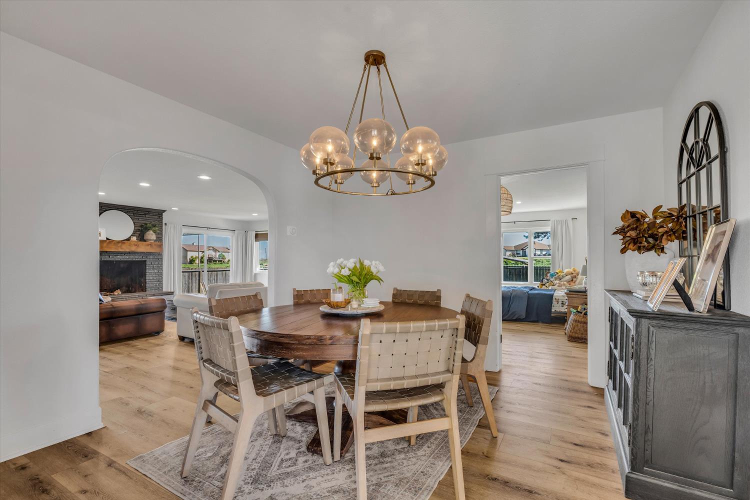 6450 Delta Avenue Tracy, CA 95304 - Photo 18 of 49 a view of a dining room with furniture wooden floor and chandelier
